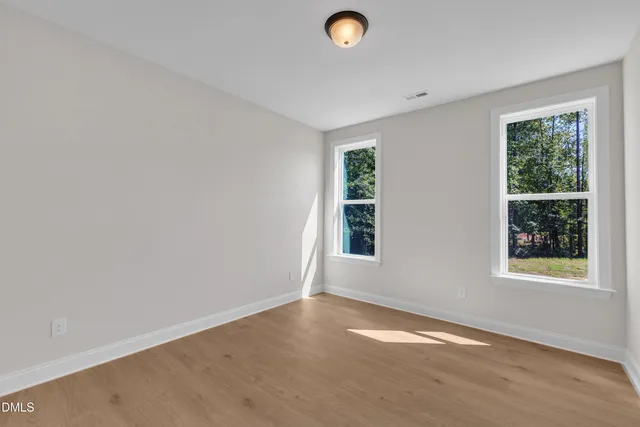 an empty room with windows