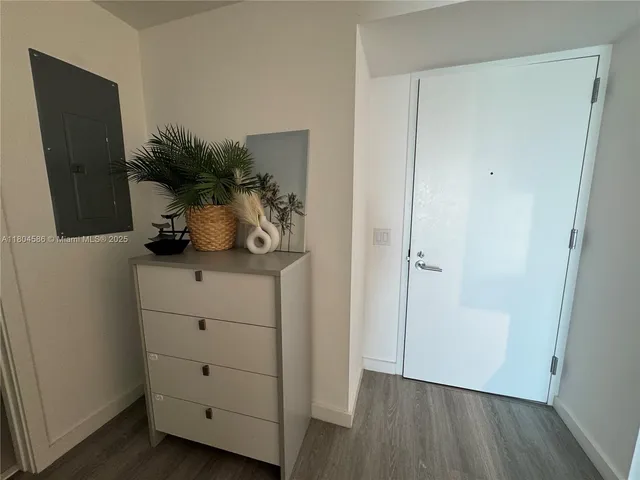 a view of closet with wooden floor