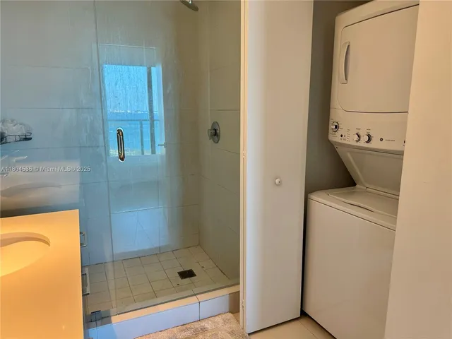 a bathroom with a shower and toilet