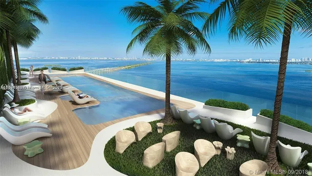 a view of a lake with furniture