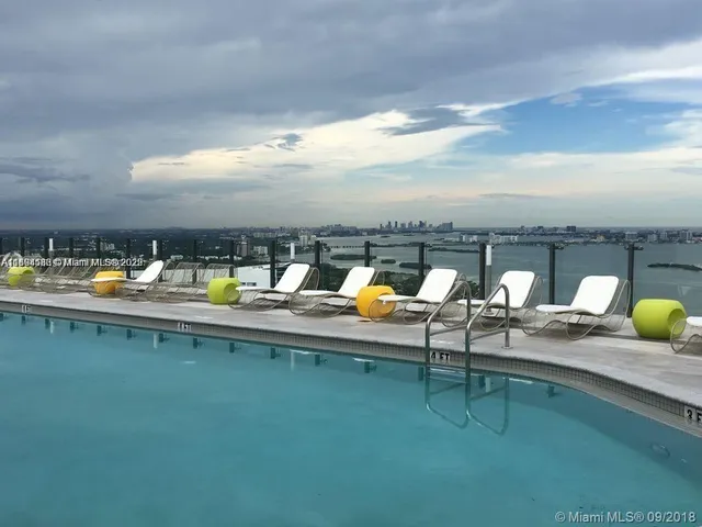 a view of pool with building exterior