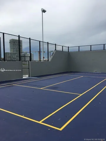a view of a patio with table and chairs potted plants
