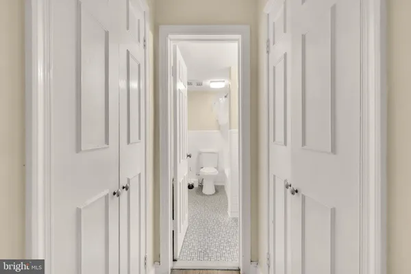 a bathroom with a sink toilet and a mirror