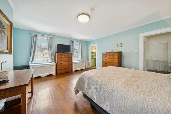 a bedroom with a bed and a dresser