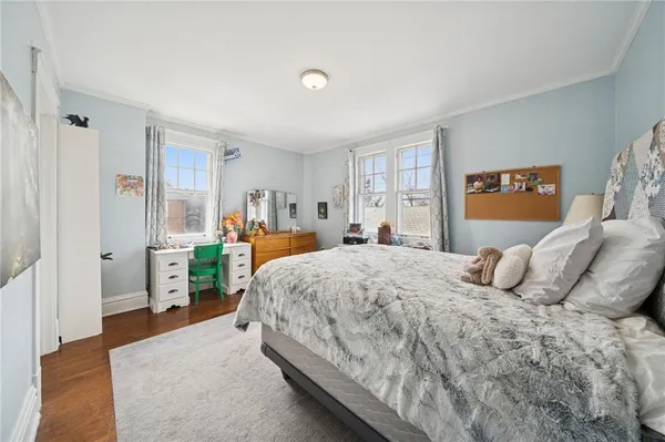 a bedroom with a bed and a couch