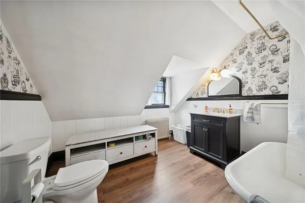 a living room with a stove and a fireplace