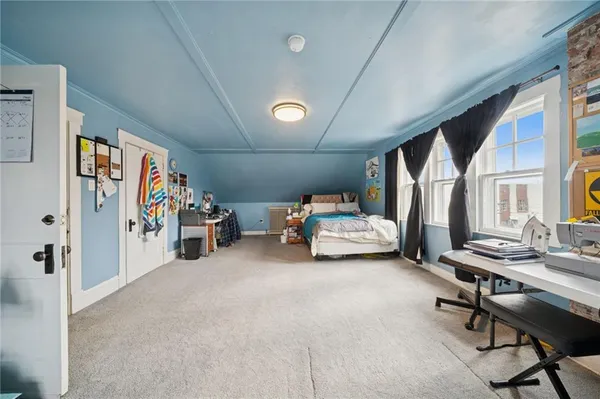 a view of a livingroom with furniture and a window