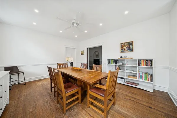 a view of a dining room with furniture and wooden floor