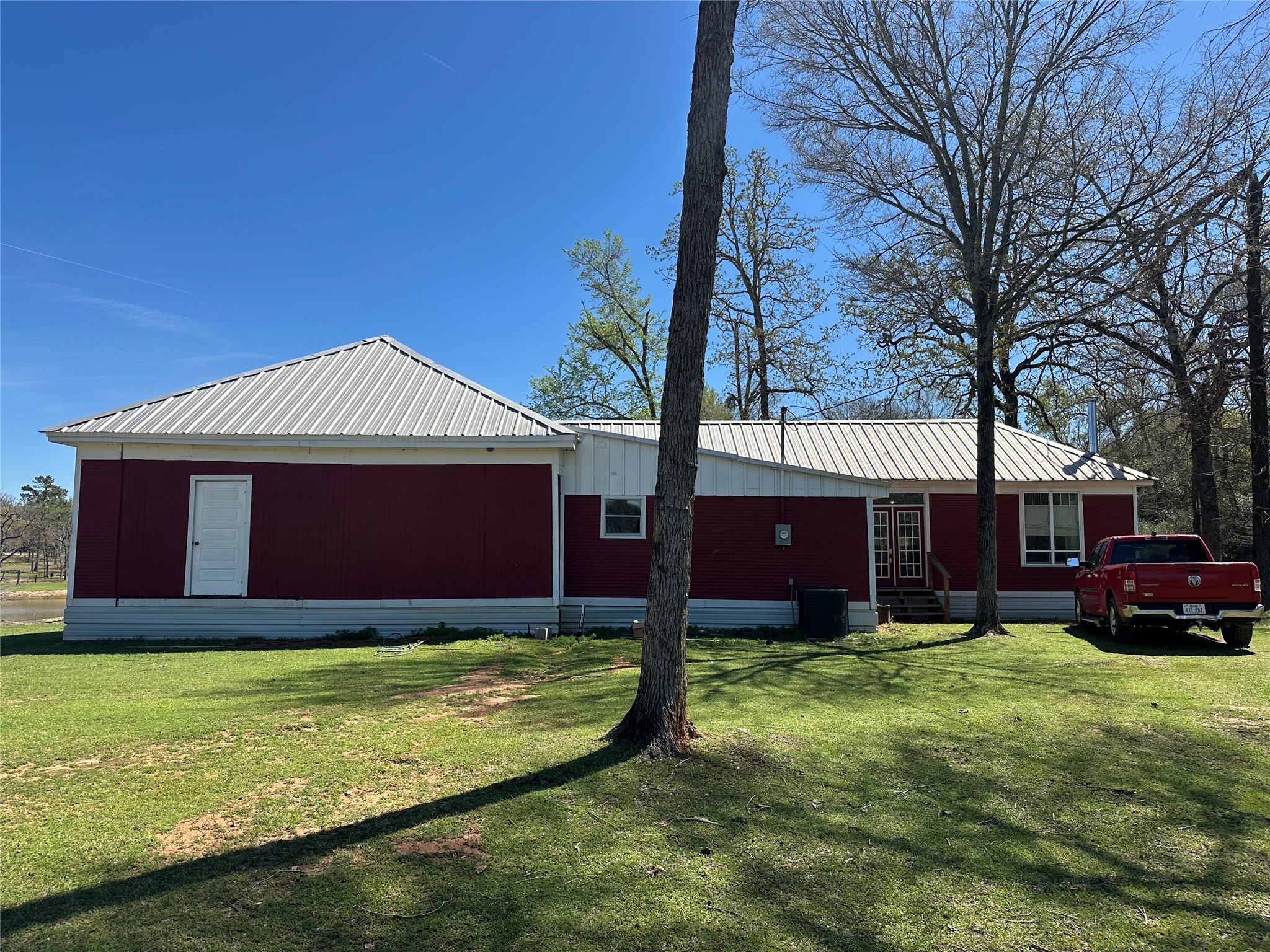 8773 I-45 Street South Centerville, TX 75833 - Photo 19 of 35 a front view of a house with yard and trees