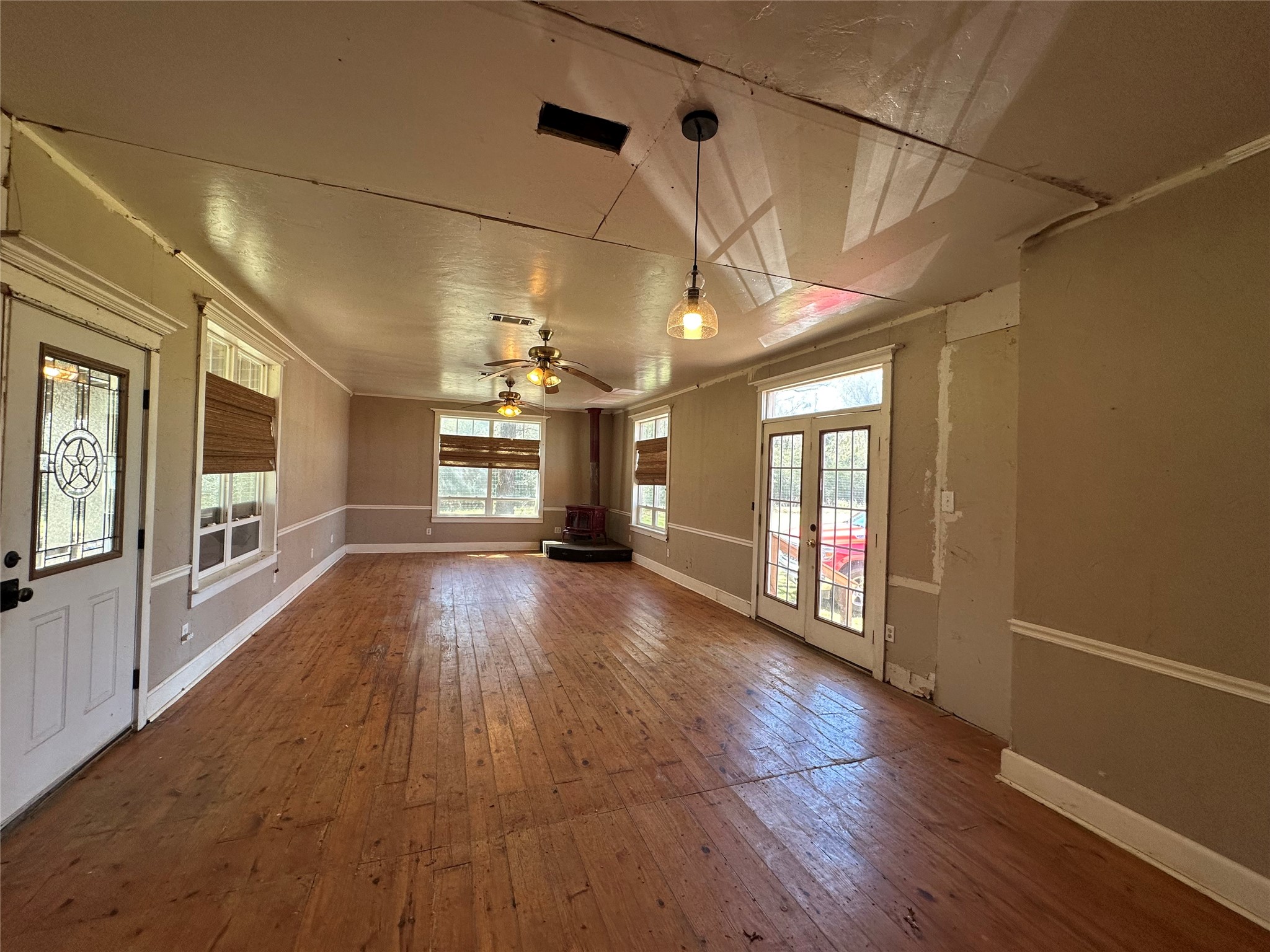 8773 I-45 Street South Centerville, TX 75833 - Photo 3 of 35 a view of a room with wooden floor and windows