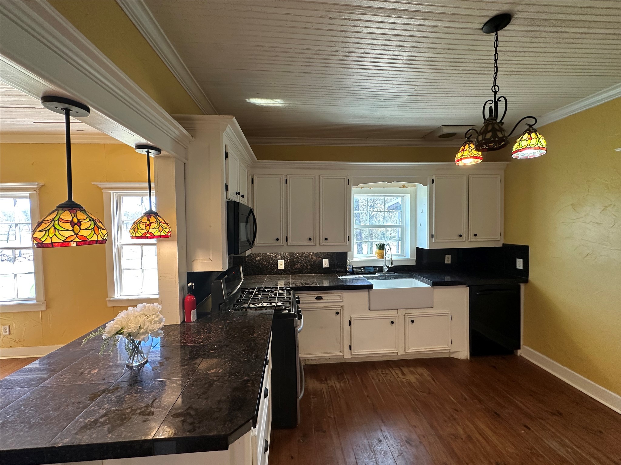 8773 I-45 Street South Centerville, TX 75833 - Photo 5 of 35 a kitchen with stainless steel appliances granite countertop a sink a stove and a wooden floors