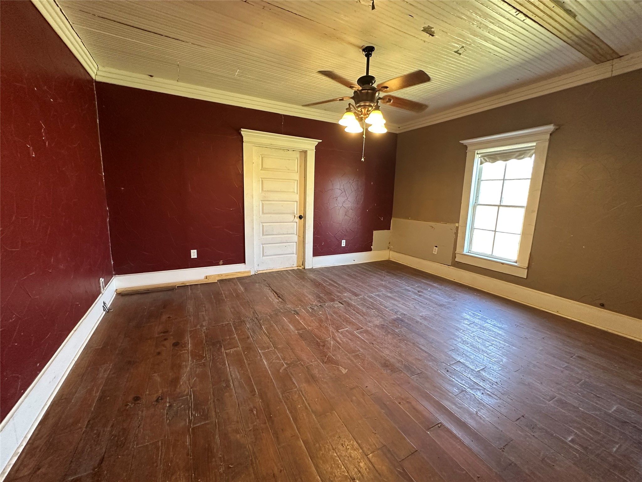 8773 I-45 Street South Centerville, TX 75833 - Photo 10 of 35 a view of an empty room with a window and wooden floor