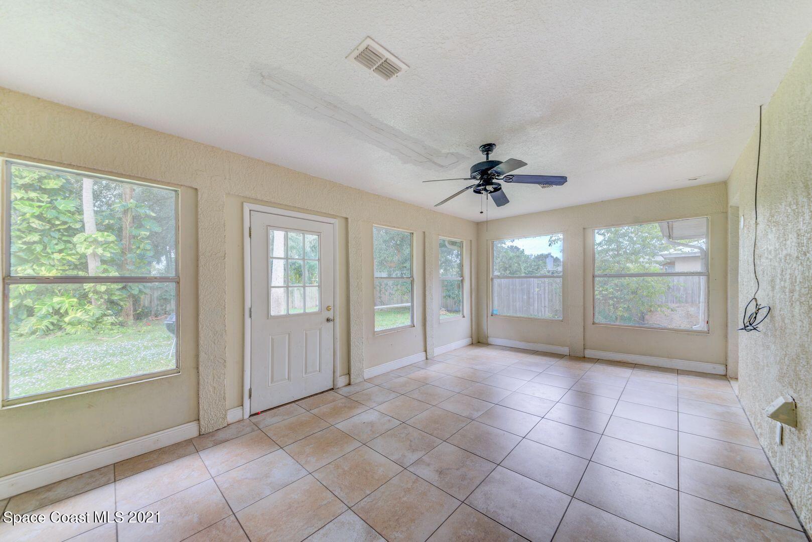 6025 Adina Road Cocoa, FL 32927 - Photo 12 of 22 a view of an empty room with a window