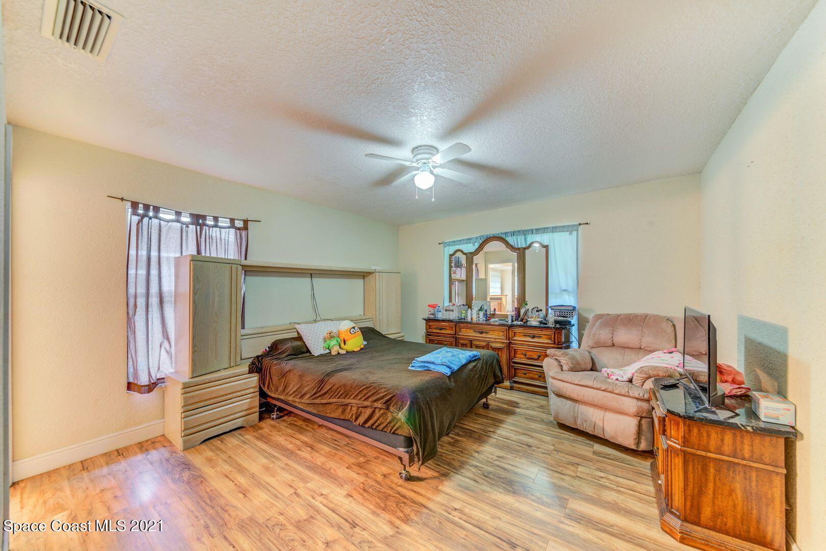 6025 Adina Road Cocoa, FL 32927 - Photo 13 of 22 a bedroom with bed and window