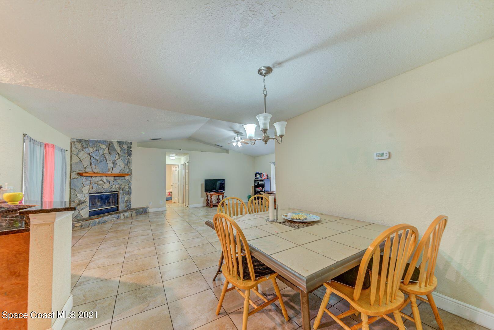 6025 Adina Road Cocoa, FL 32927 - Photo 6 of 22 a view of a dining room with furniture