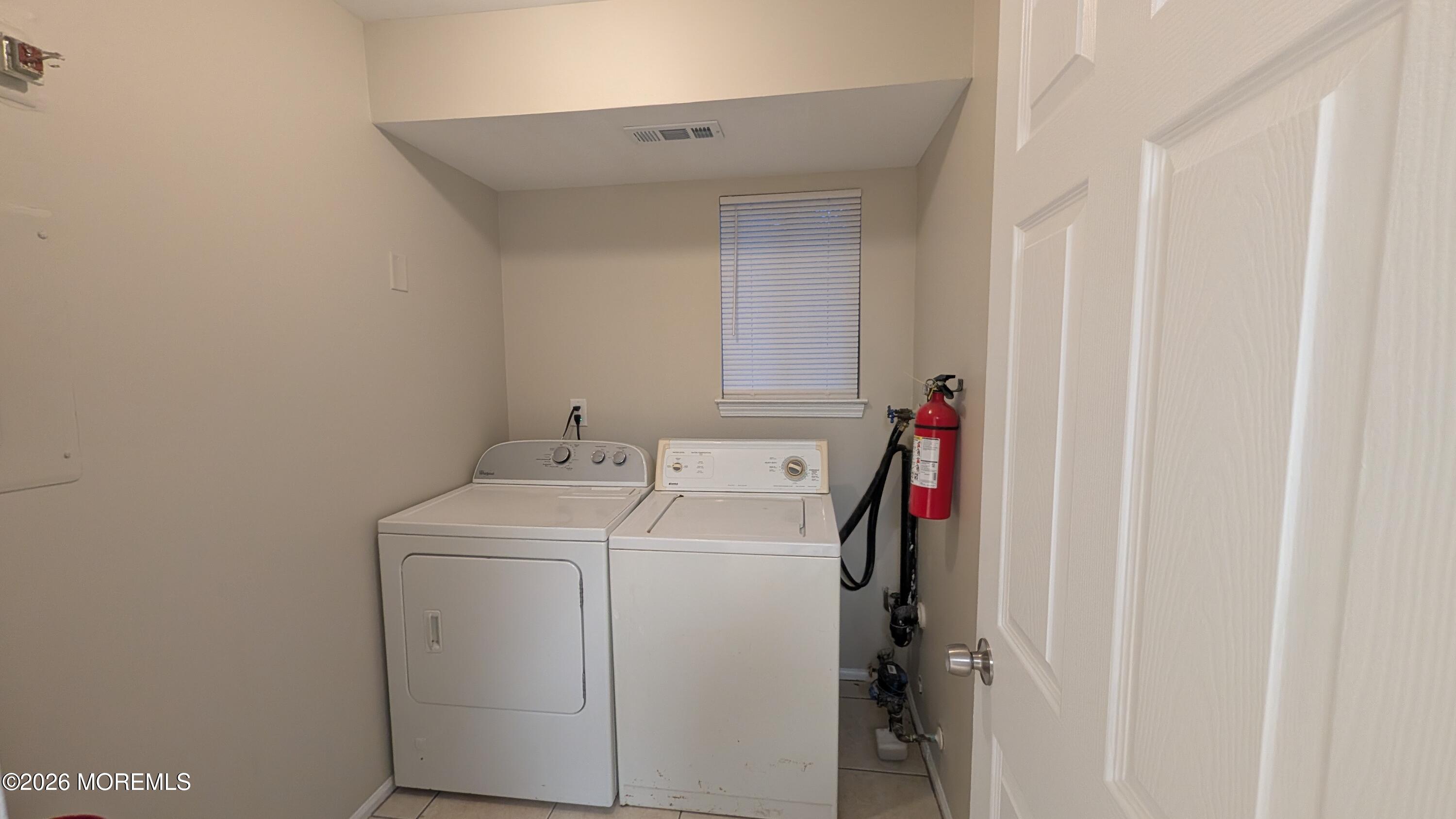 21 Jesse Road Howell, NJ 07731 - Photo 14 of 30 a utility room with dryer and washer