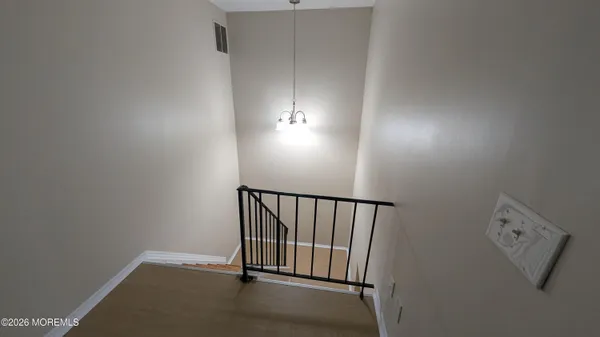 a view of a hallway with windows