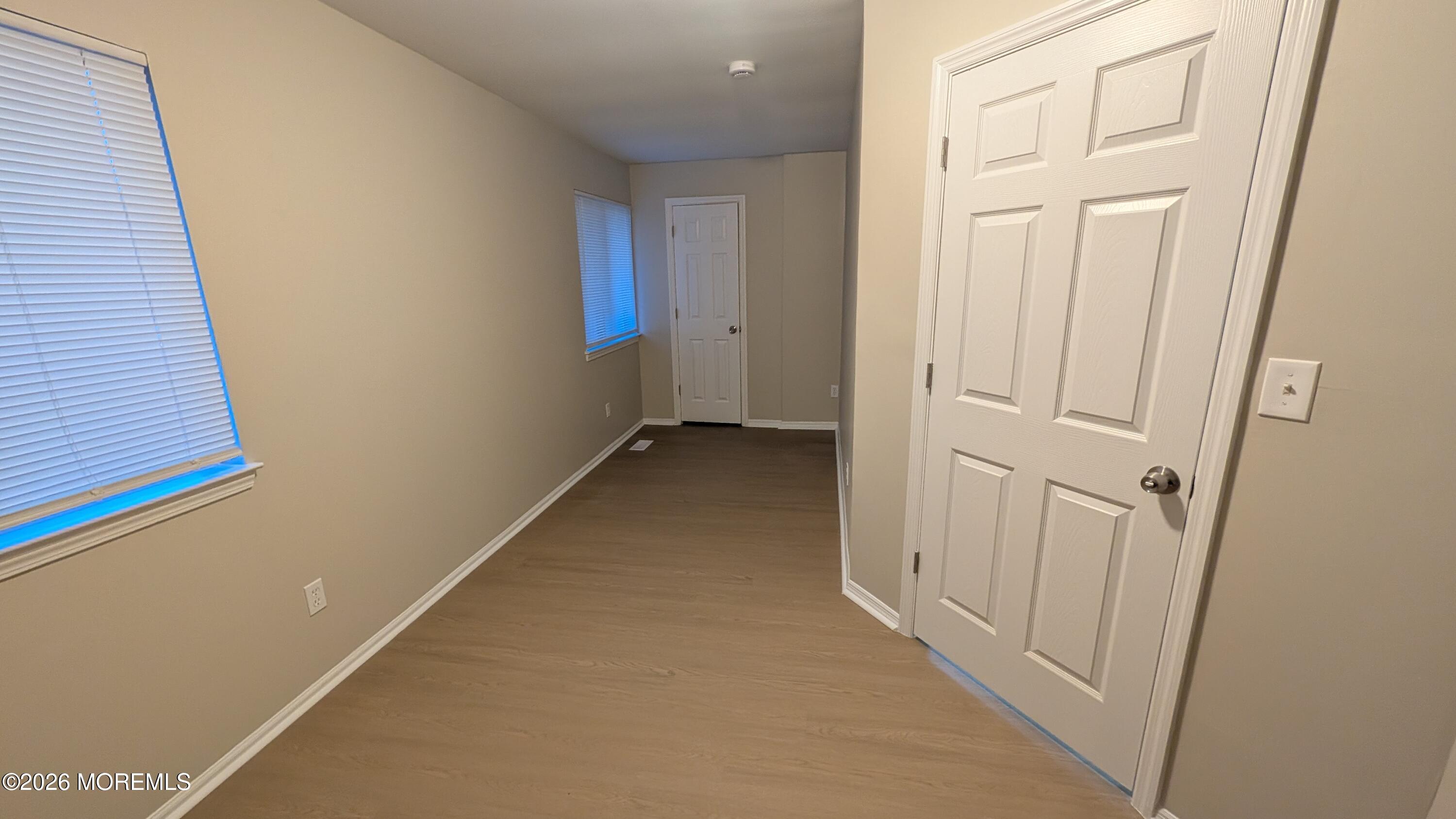 21 Jesse Road Howell, NJ 07731 - Photo 21 of 30 a view of a hallway with wooden floor
