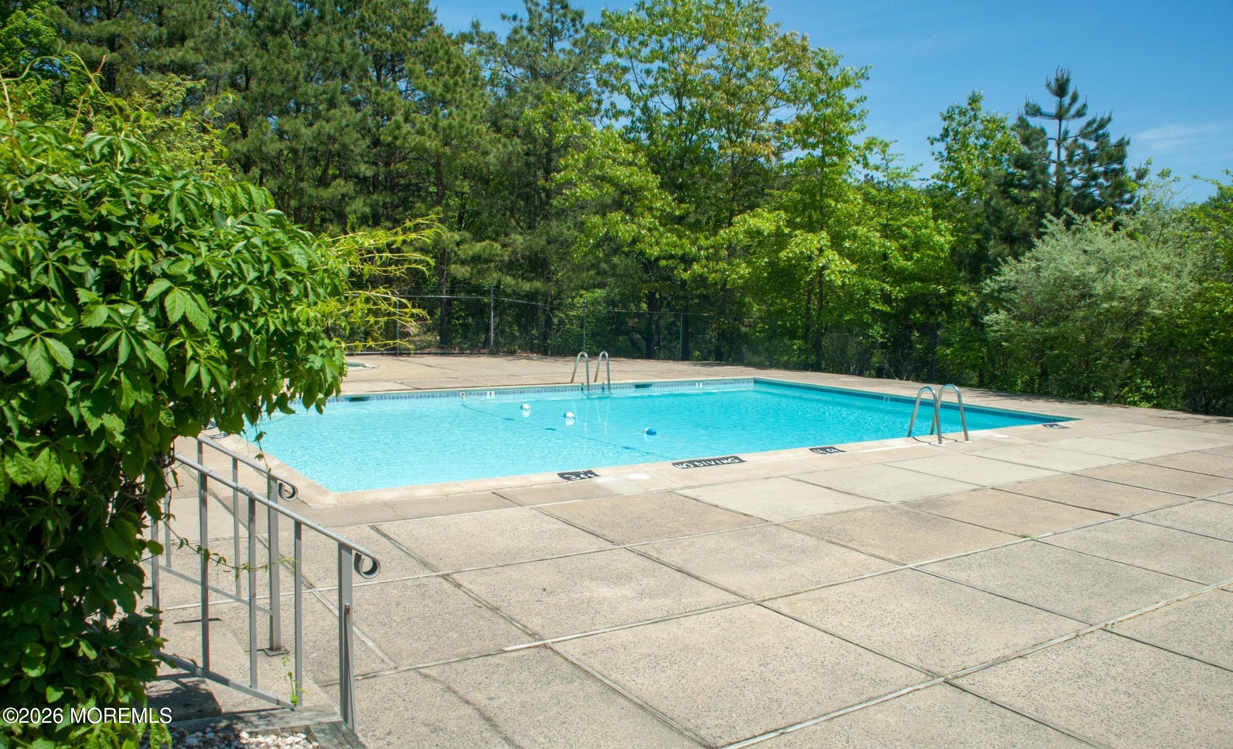 21 Jesse Road Howell, NJ 07731 - Photo 27 of 30 a view of yard with seating space and trees in the background