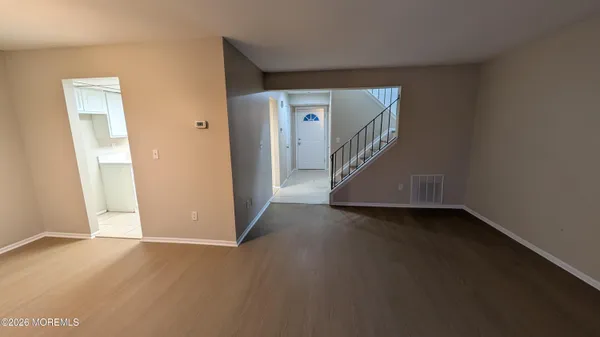 a view of a hallway with staircase