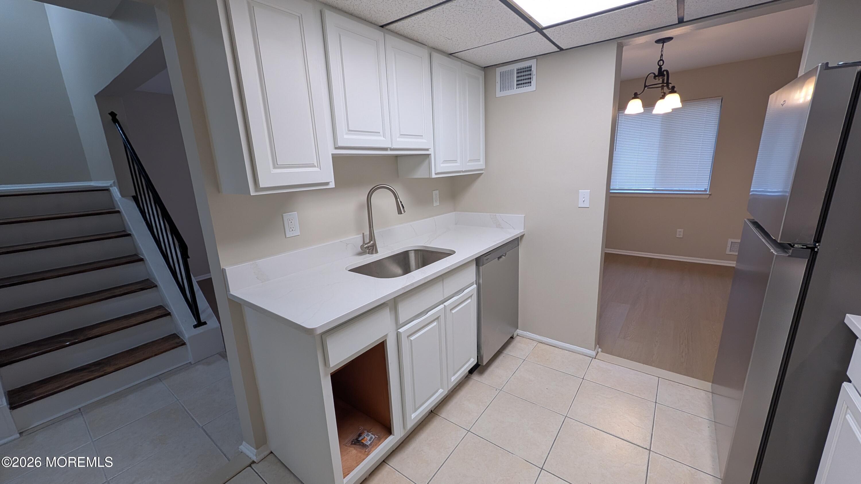 21 Jesse Road Howell, NJ 07731 - Photo 9 of 30 a kitchen with a sink and cabinets