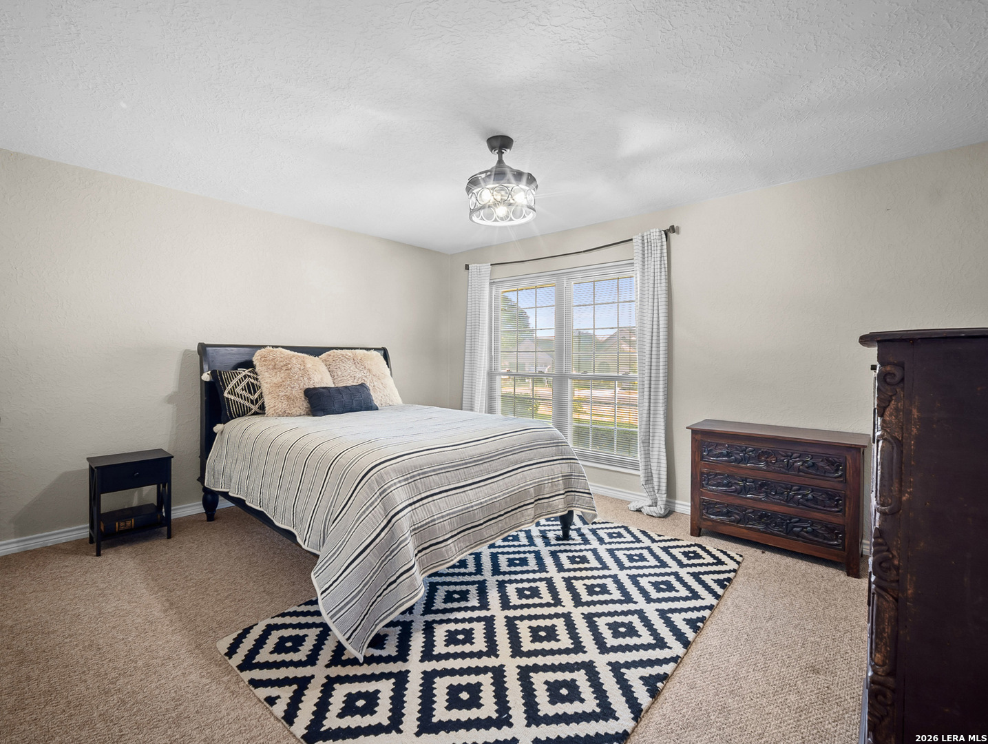 3620 Chestnut Court Cibolo, TX 78108 - Photo 32 of 45 a bedroom with a bed and wooden floor