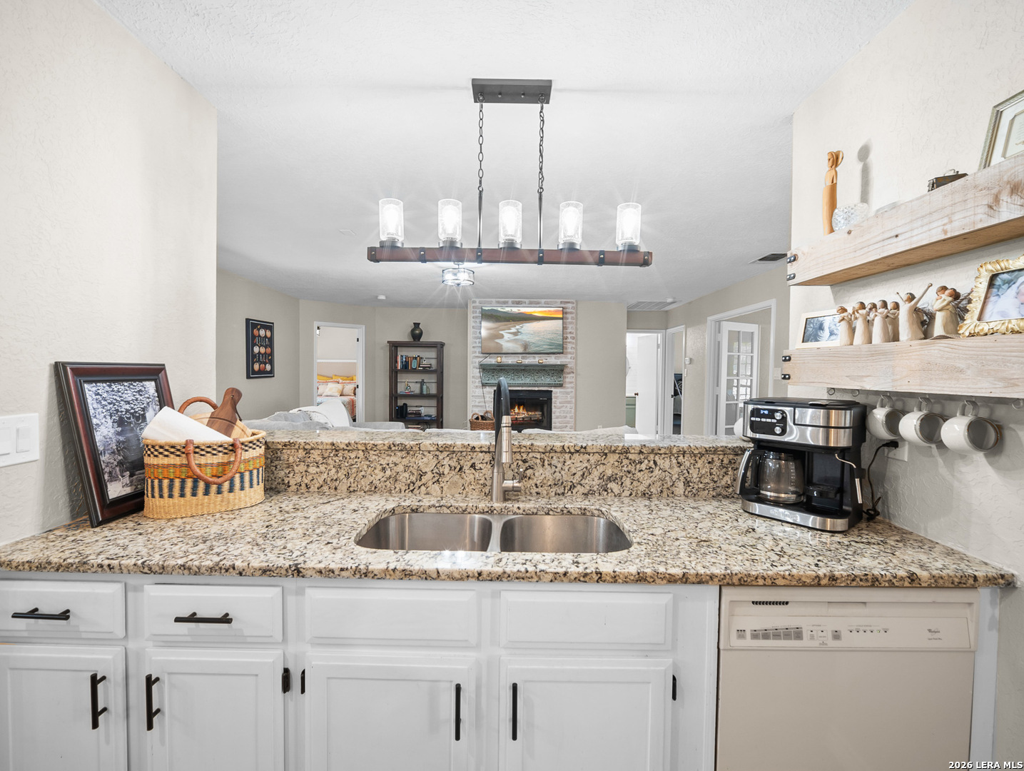 3620 Chestnut Court Cibolo, TX 78108 - Photo 9 of 45 a kitchen with granite countertop a sink and cabinets