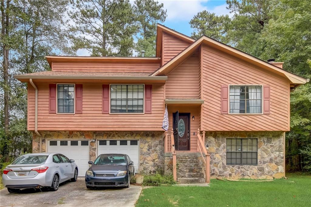 a car parked in front of white house