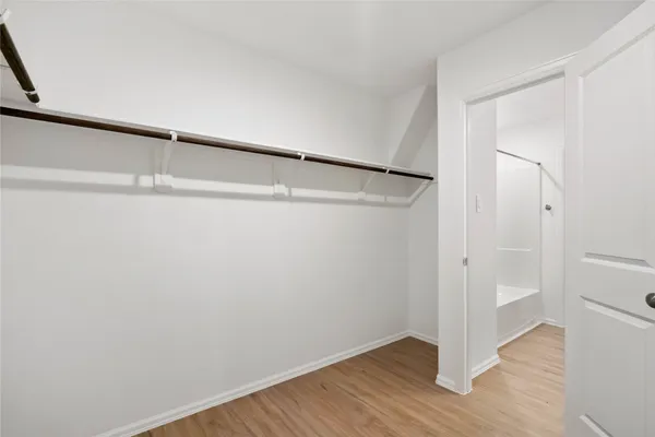 a view of an empty walk in closet