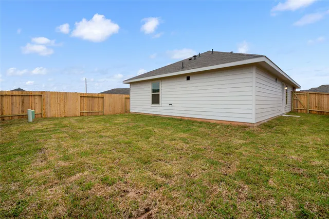 a view of a backyard of the house