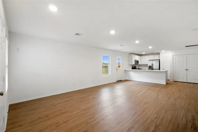a view of kitchen with wooden floor