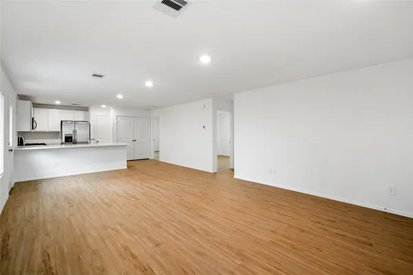 a view of kitchen with a sink and wooden floor