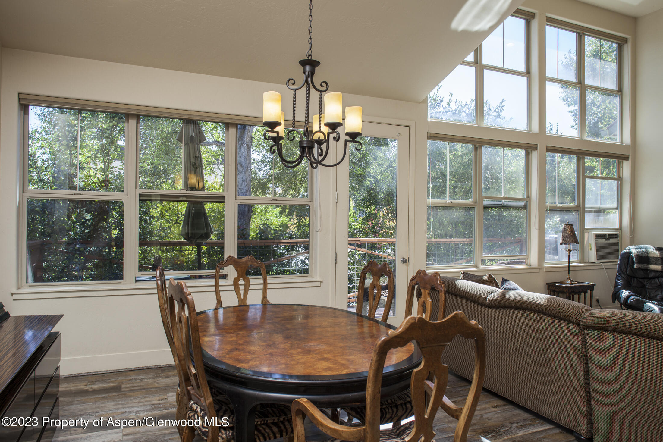 532 Evans Court Basalt, CO 81621 - Photo 7 of 18 a view of a dining room with furniture large windows and wooden floor