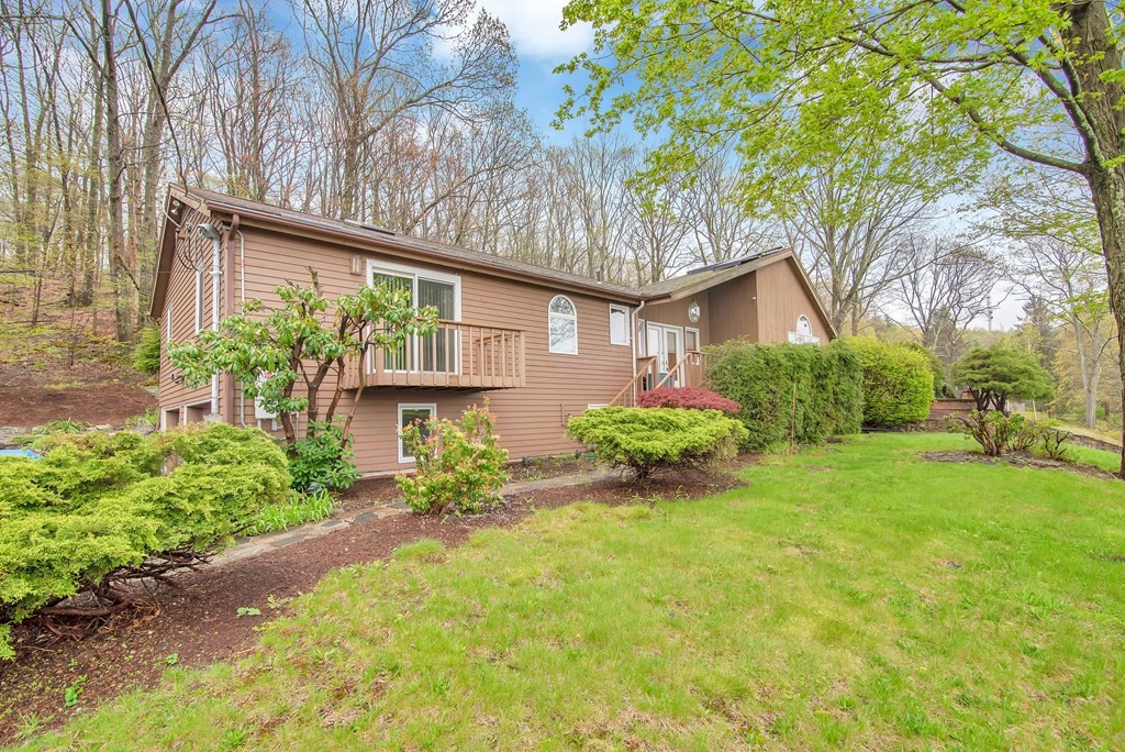 660 Ridge Road Wilbraham, MA 01095 - Photo 1 of 31 front view of a house with a yard