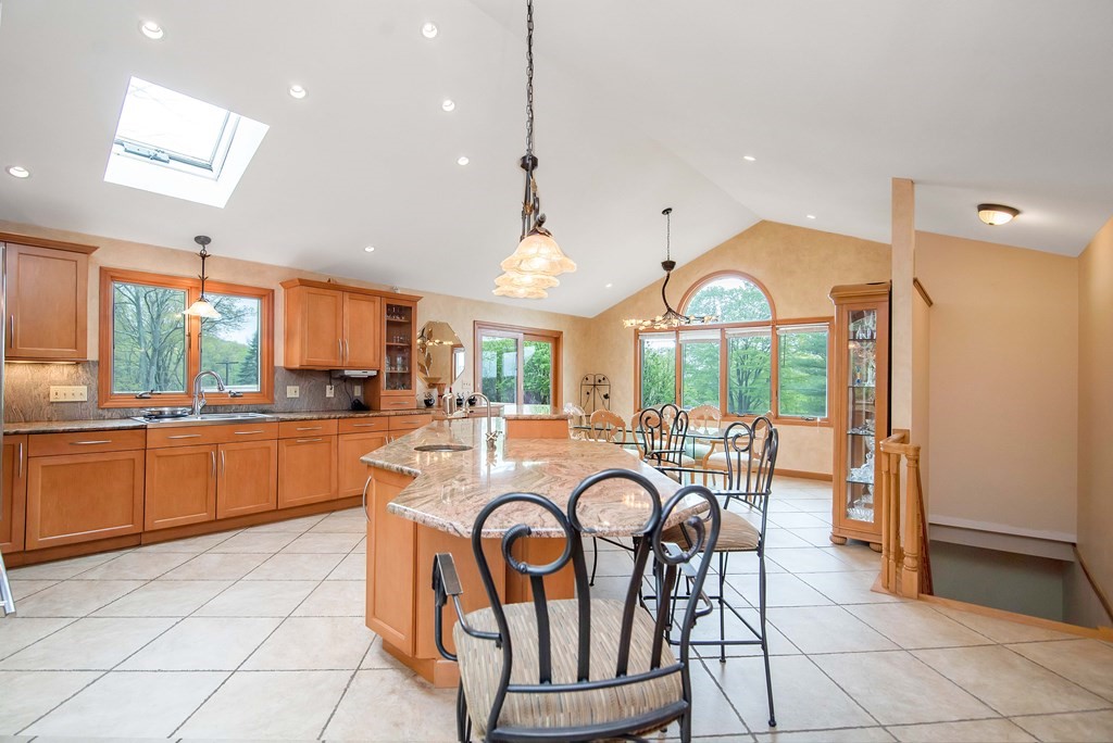 660 Ridge Road Wilbraham, MA 01095 - Photo 8 of 31 a large kitchen with a table and chairs
