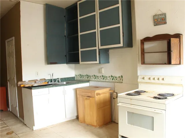 a kitchen with a stove and a microwave