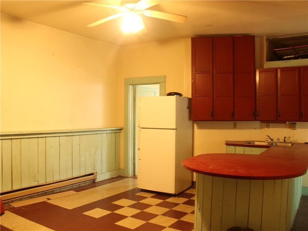 344-346 3rd Street California, PA 15419 - Photo 14 of 21 a kitchen with a refrigerator and a stove