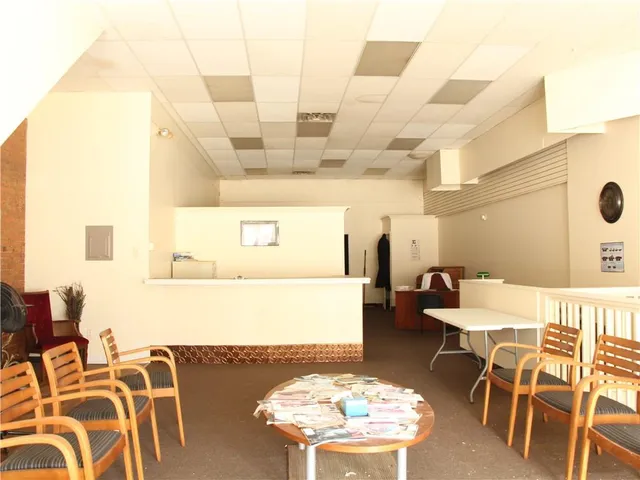 a balcony with table and chairs