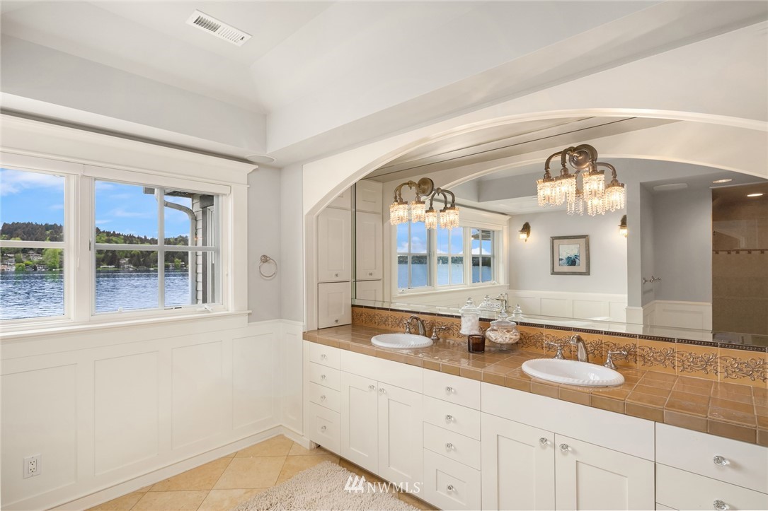 6625 Ripley Ln S East Renton, WA 98056 - Photo 22 of 39 a bathroom with granite countertop a sink and a mirror