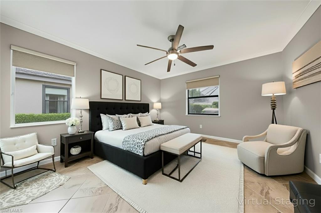 19862 Bittersweet Lane Estero, FL 33928 - Photo 16 of 50 a spacious bedroom with a bed a couch and a window