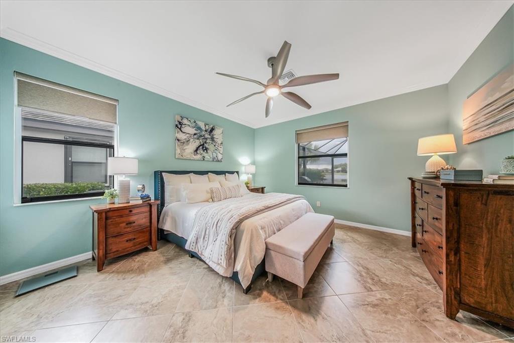 19862 Bittersweet Lane Estero, FL 33928 - Photo 17 of 50 Bedroom with ornamental molding, a ceiling fan, and light tile patterned floors
