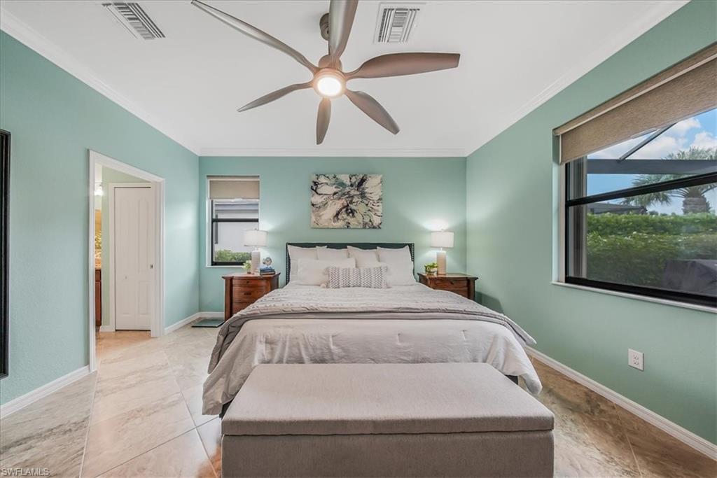 19862 Bittersweet Lane Estero, FL 33928 - Photo 18 of 50 Bedroom with ornamental molding and ceiling fan