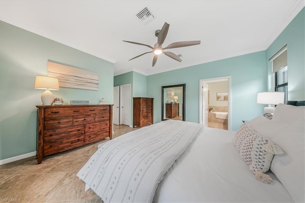 19862 Bittersweet Lane Estero, FL 33928 - Photo 19 of 50 a bed room with a bed and a dresser