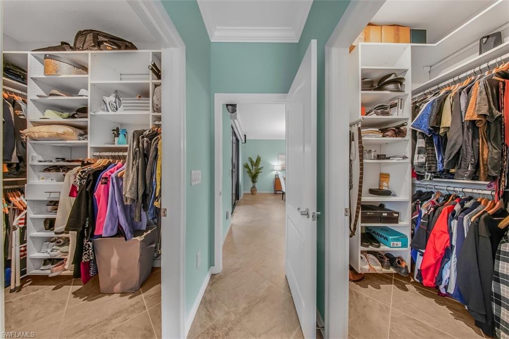 19862 Bittersweet Lane Estero, FL 33928 - Photo 20 of 50 a view of walk in closet with clothes and shoes
