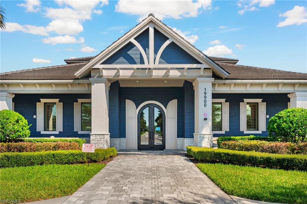 19862 Bittersweet Lane Estero, FL 33928 - Photo 50 of 50 a view of a house with a small yard plants and large tree