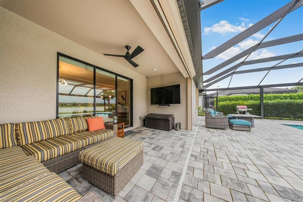 19862 Bittersweet Lane Estero, FL 33928 - Photo 7 of 50 View of patio with an outdoor living space, a sunroom, ceiling fan, and a lanai