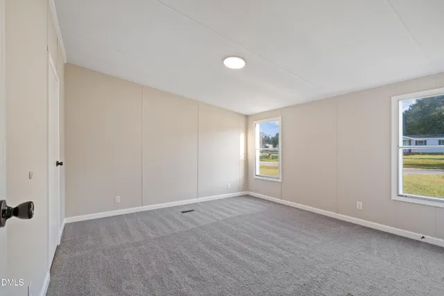 an empty room with windows