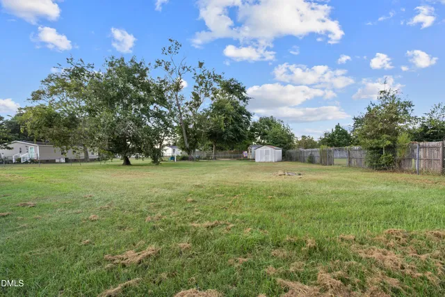 a view of outdoor space with deck and yard