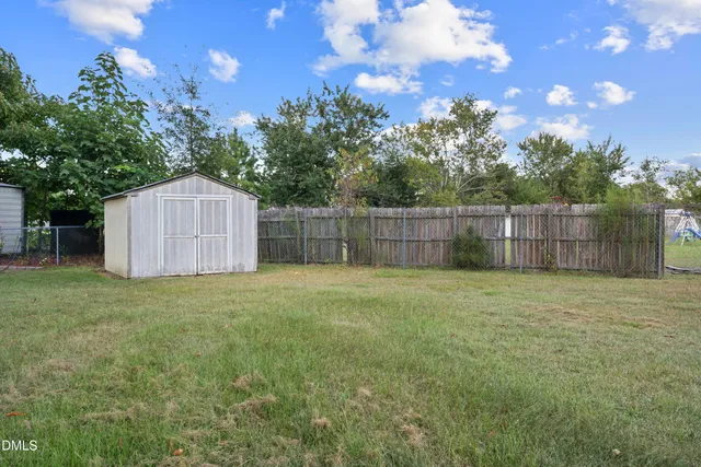 a backyard of a house with lots of green space