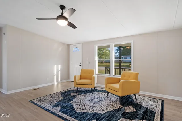 a living room with furniture and a window